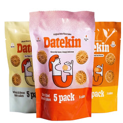 Three packages of Datekin date-filled snack cakes on a white background