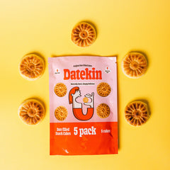 Datekin Original Date snack cake package with cakes in a semi circle on a yellow background