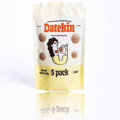 Datekin sesame snack balls packaging on a white background with a reflection
