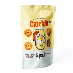 Yellow and green packaging of Datekin wheat and bran date cakes on a white background side view